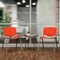 Flash Furniture HERCULES Series 880 lb. Capacity Orange Plastic Stack Chair with Titanium Gray Powder Coated Frame RUT-F01A-OR-GG - alternate 2